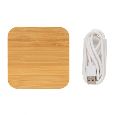 Logotrade presentreklam bild: 5W trådlös laddare i bambu med USB